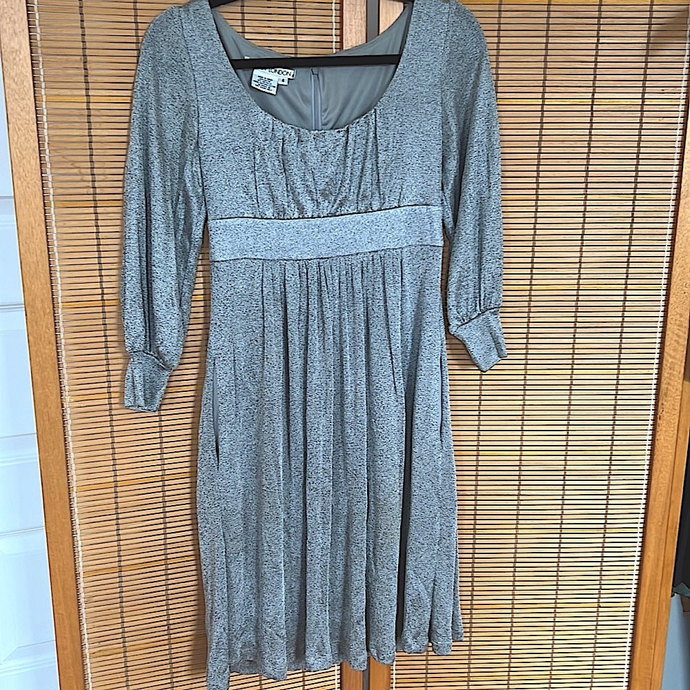 Long sleeve fit flare silver cocktail dress with beautiful low scoop neckline.